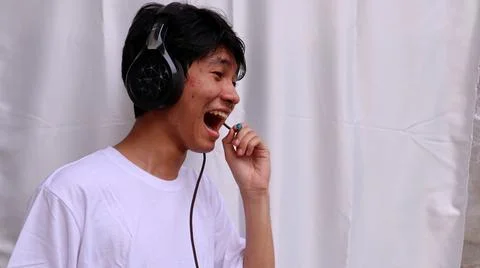 Asian man is using headset 스톡 사진