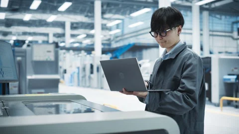 Asian Man Using Laptop And Solder Jet Printer On Factory 動画素材 260481442