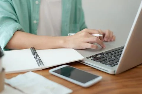 Asian man using laptop computer in cafe, Stock Photos
