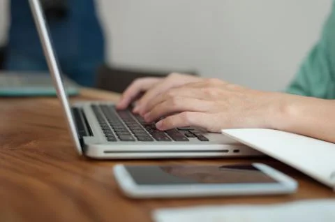 Asian man using laptop computer in cafe, Stock Photos