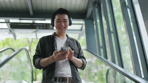 Asian man using the mass escalator In the journey of transportation in City. Stock Footage 143012608
