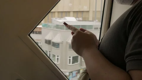 Asian man using mobile phone while ride in skytrain public transportation Stock Footage 201449959