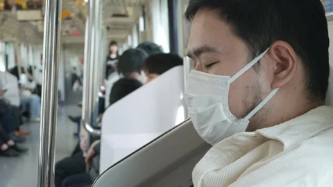 An asian man using mobile smartphone while sitting in japan train public tr.. Stock Footage 323916380