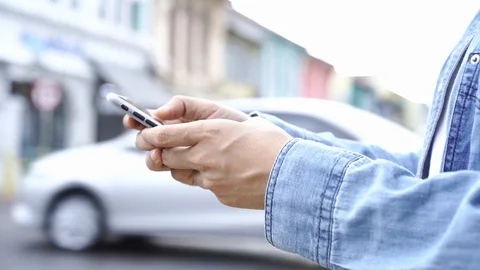 Asian man using smartphone with blurred city street Video stock 121604866