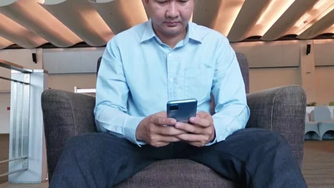 Asian Man Using Smartphone Gadget Social Media Mobile Application Stock Footage 296640449