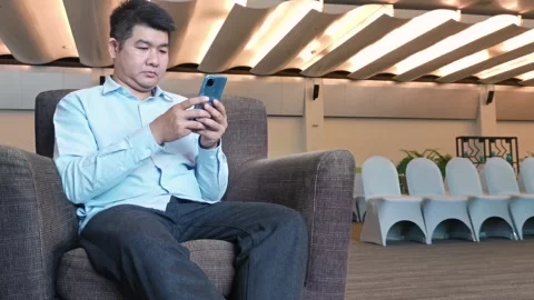 Asian Man Using Smartphone Gadget Social Media Mobile Application Stock Footage 296640457