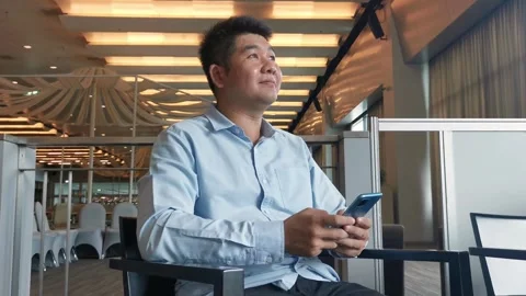 Asian man using smartphone gadget social media mobile application Stock Footage 296640779