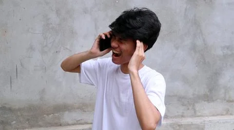 Asian man is using smartphone 写真素材