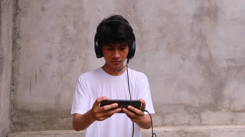 Asian man is using smartphone 스톡 사진