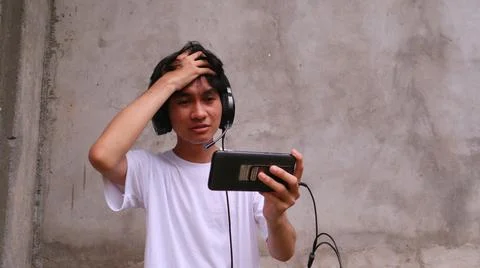 Asian man is using smartphone 写真素材