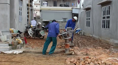 Asian man using soil compacto Stock Footage 49699025