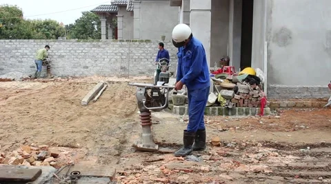 Asian man using soil compacto Stock Footage 49699055