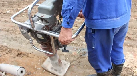 Asian man using soil compacto Stock Footage 49699063