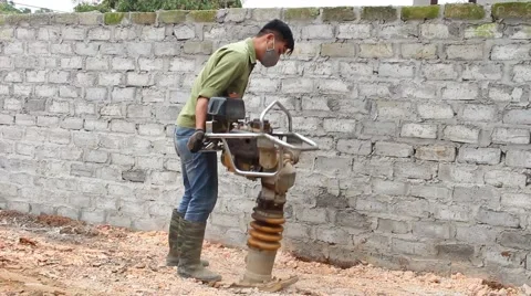 Asian man using soil compacto Video stock 49699079