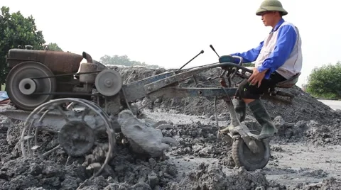 Asian man using soil compacto Stock Footage 49699577