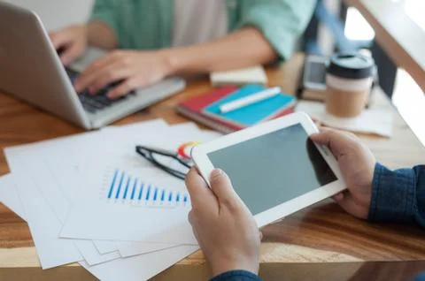 Asian man using tablet pc in office Stock Photos