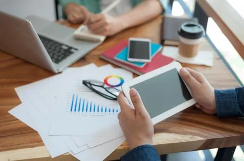 Asian man using tablet pc in office Stock Photos