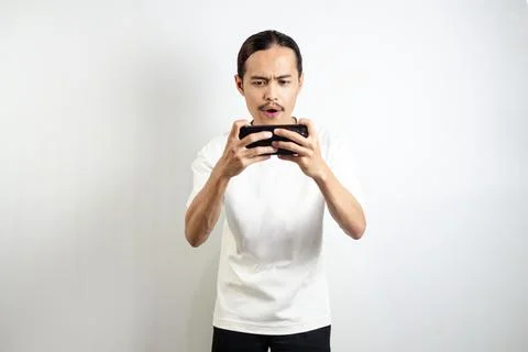 Asian man with various expressions while holding mobile phone. isolated in .. Stock Photos