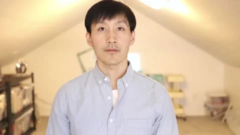 Asian Man on a Video Call while Nodding and Listening Stock Footage 165128164