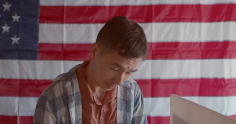 Asian man voting at a polling station Stock Footage 274960106