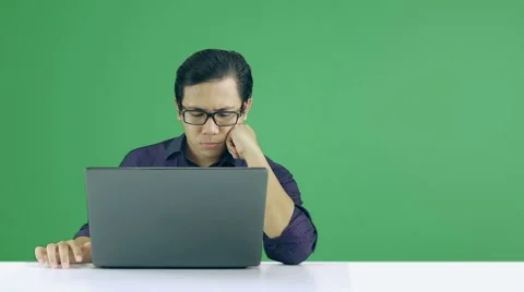Asian Man Waiting Loading Process To Complete  - Green Screen 60 fps Stock Footage 60610797