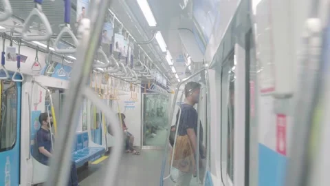 An asian man is walking out of the mrt train. Stock Footage 224257170