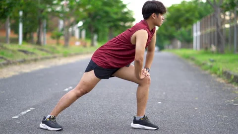 Asian man warm up before running. Stock Footage 198184497