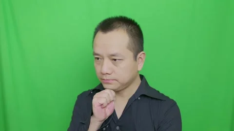Asian man who facing problem, pinches his chin while thinking Stock Footage 321231787