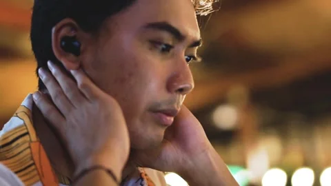 Asian man worker having video call on laptop computer in cafe indoor at night. Stock Footage 289030998