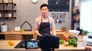 Asian Man Working On Food Blogger Concept With Fruits And Vegetables In Kitchen. Stock Footage