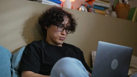 Asian Man Working on Laptop during Remote Work at Home Stock Footage 338421646