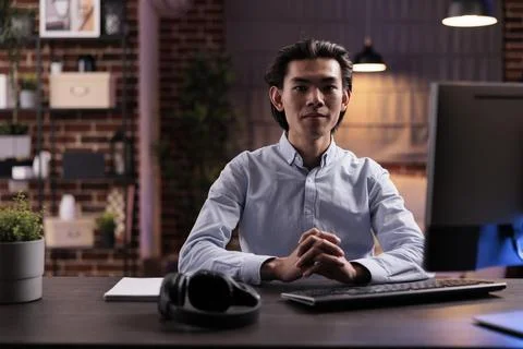 Asian man working remotely on computer Foto stock