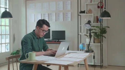 Asian Man Works With Laptop Computer And Storyboard. Video Editing, Comics Vídeos de archivo 160447589