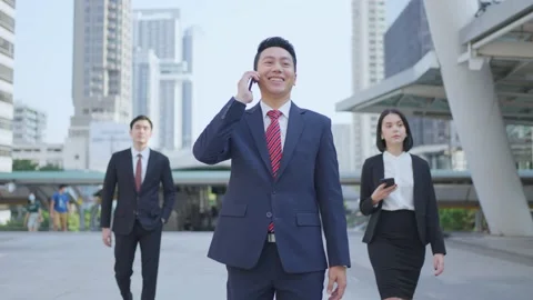 Asian manager smart businessman using smartphone in city. Stock Footage 147912602