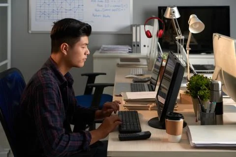 Asian Manager Wrapped up in Work 스톡 사진