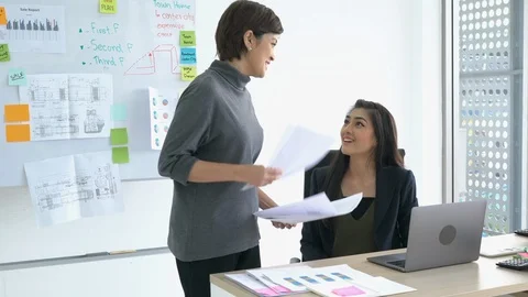 Asian managers talking achievement task to employee female. Stock Footage 109364190