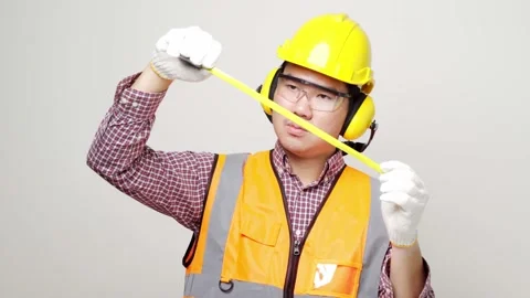 Asian mechanics craftsman pull the measuring tape ready for working home service Stock Footage 144262243