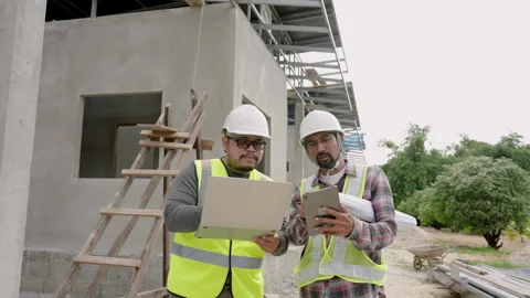 Asian men, construction engineers, standing together discussing constructio.. 스톡 동영상 262713749