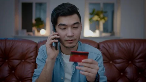 Asian men solving problem with credit card. Stock Footage 105748421