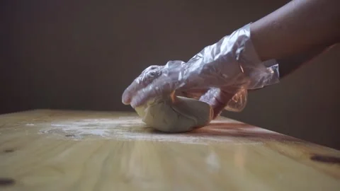 Asian men sprinkle flour  using hands with plastic gloves. Stock Footage 271146714