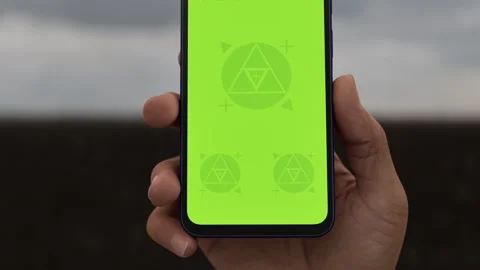 Asian middle aged male using smartphone with a blank green screen Stock Footage 293567735