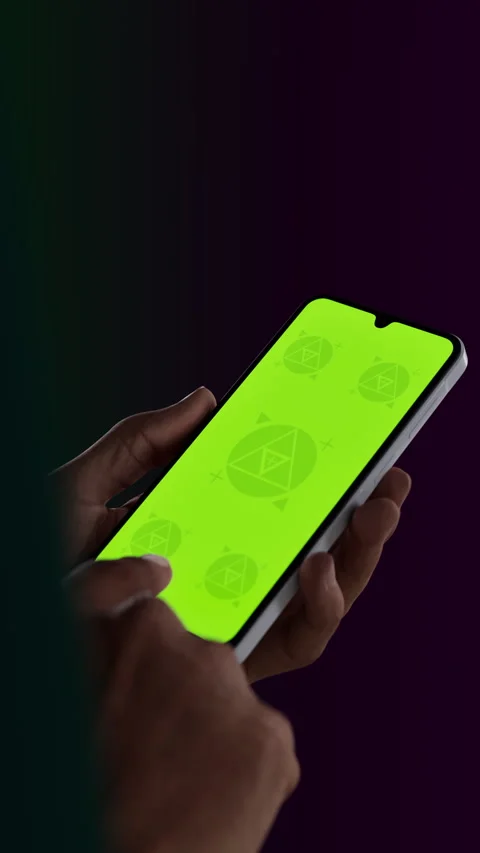 Asian middle aged male using smartphone with a blank green screen Stock Footage 296943290