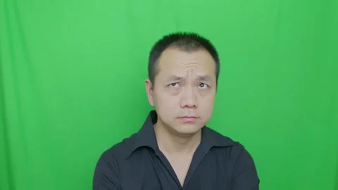 Asian middle-aged man squeeze wrinkles into foreheads Stock Footage 321231827
