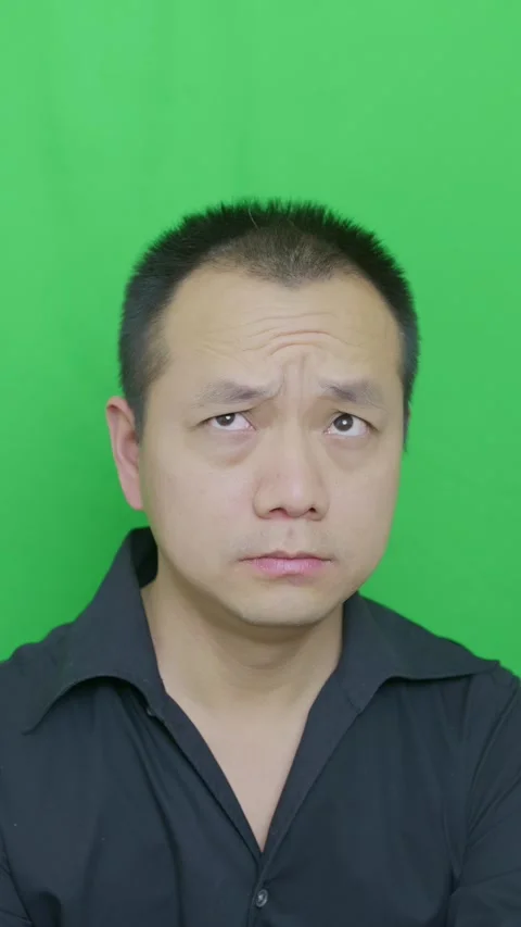 Asian middle-aged man squeeze wrinkles into foreheads Stock Footage 321232276