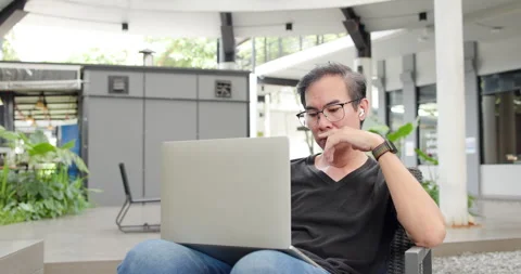Asian Middle-aged man using smartphone to shop online. Senior make financial  Stock Footage 287843691