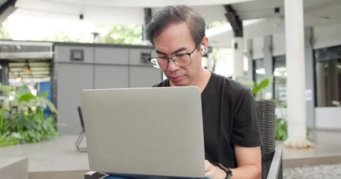 Asian Middle-aged man using smartphone to shop online. Senior make financial  Stock Footage 287843734