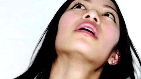 Asian Model Making Faces Stock Footage 1058448