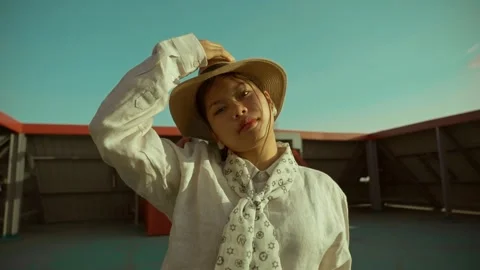 Asian model with sunglasses and hat fashionable clothing posing fashion style Video stock 297957989