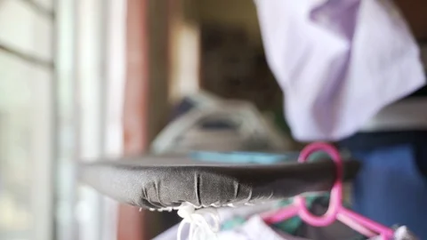 Asian mother laundry and using steam ironing Video stock 121517374