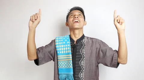Asian Muslim man gesturing pointing upwards 写真素材